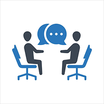 Two individuals seated and engaged in conversation with speech bubbles, symbolising an interview